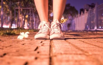 Woman's feet on pavment, ready for a prayer walk